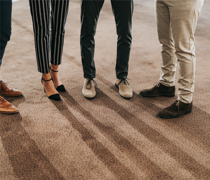 People in the office standing on carpet