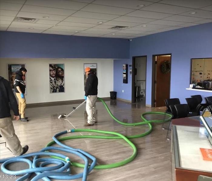 SERVPRO techs removing standing water at commercial property